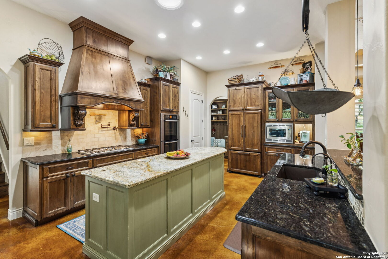 199 Shepherds Crook Helotes, TX 78023 - Photo 20 of 108 a kitchen with stainless steel appliances granite countertop a sink stove and refrigerator