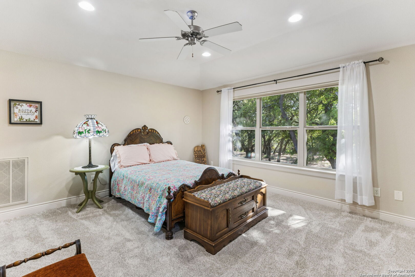 199 Shepherds Crook Helotes, TX 78023 - Photo 32 of 108 a spacious bedroom with a bed and a large window
