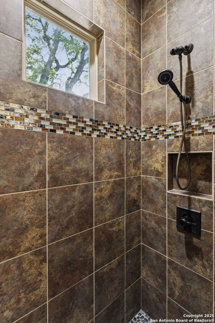 199 Shepherds Crook Helotes, TX 78023 - Photo 37 of 108 a bathroom with a shower and a sink