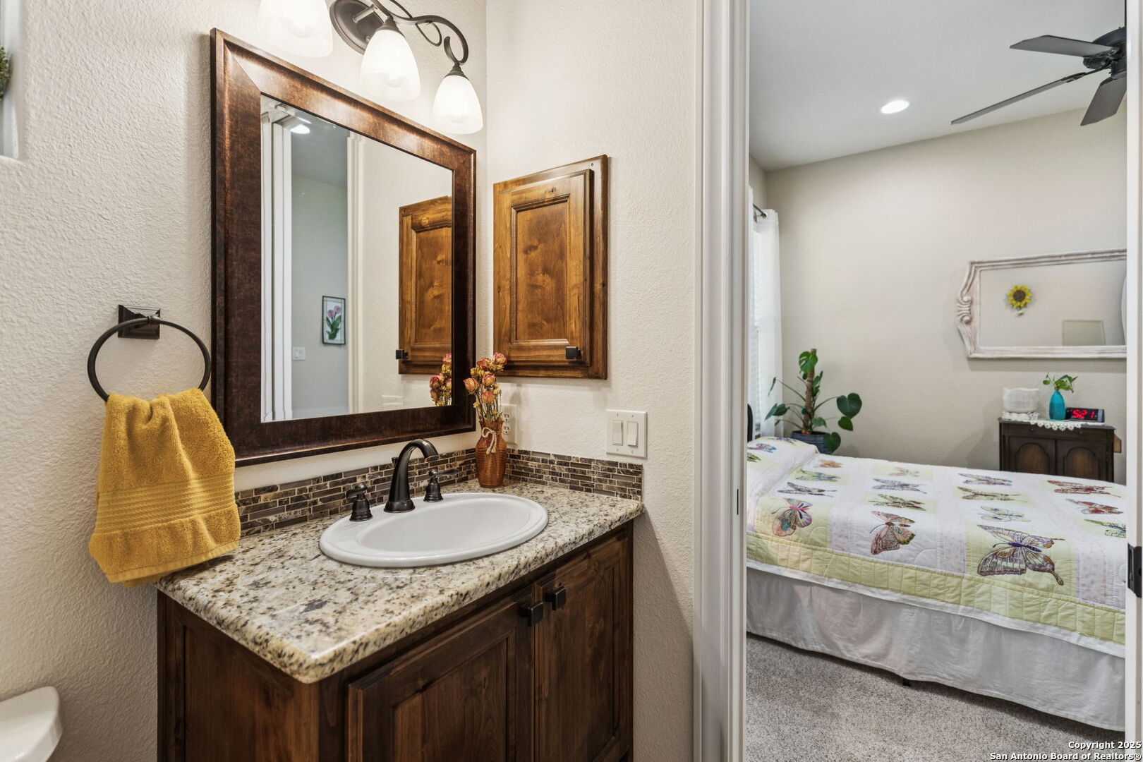 199 Shepherds Crook Helotes, TX 78023 - Photo 45 of 108 a bathroom with a sink vanity and a mirror