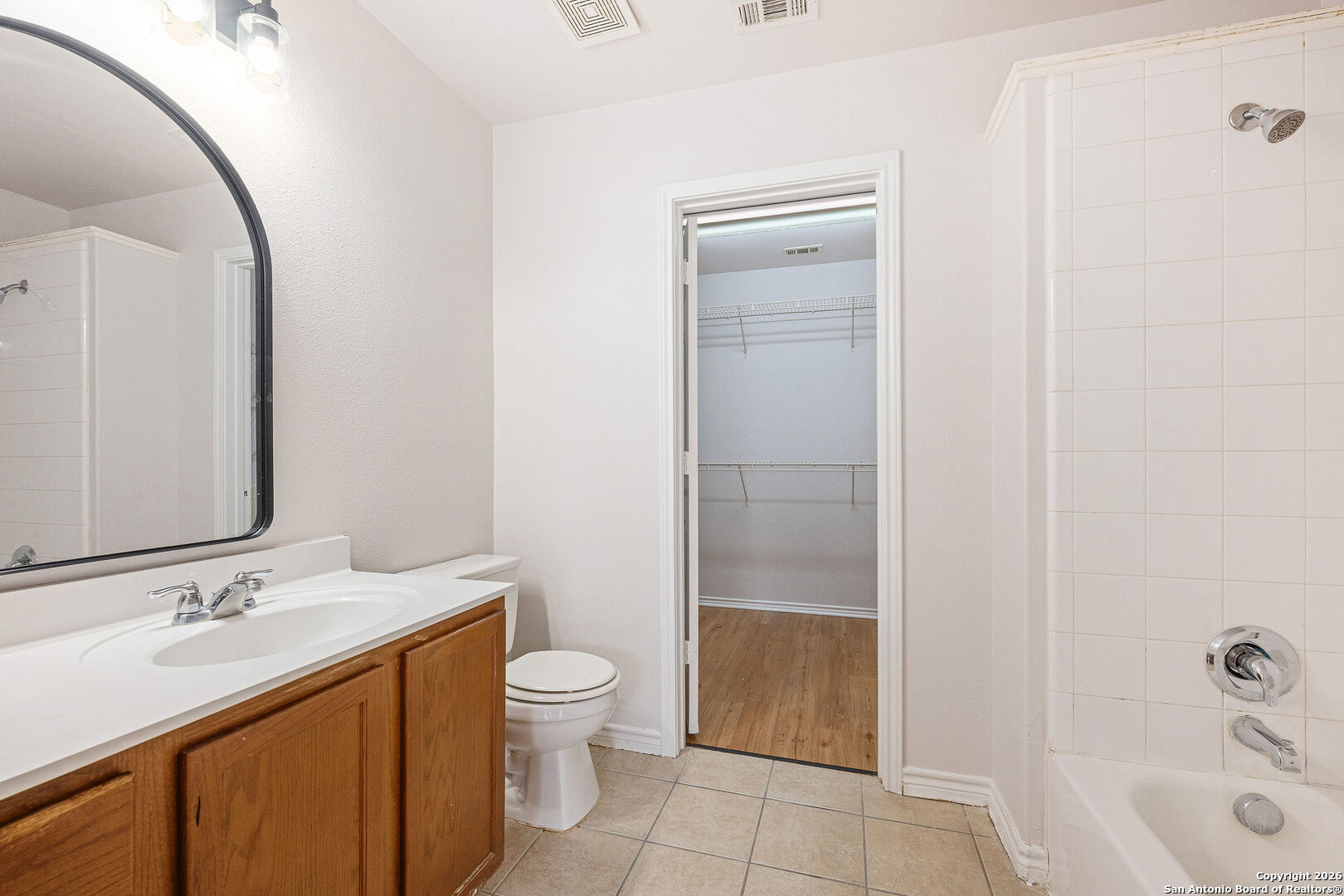 2735 Moon Rock Converse, TX 78109 - Photo 13 of 21 a bathroom with a sink a toilet and shower
