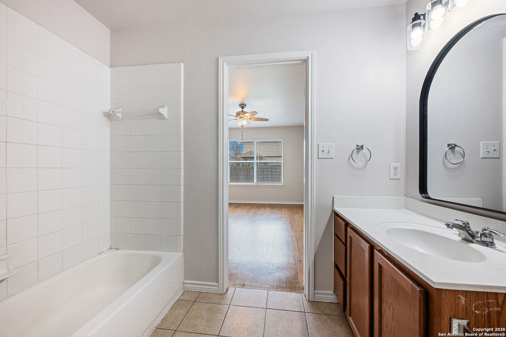 2735 Moon Rock Converse, TX 78109 - Photo 14 of 21 a bathroom with a tub sink and mirror