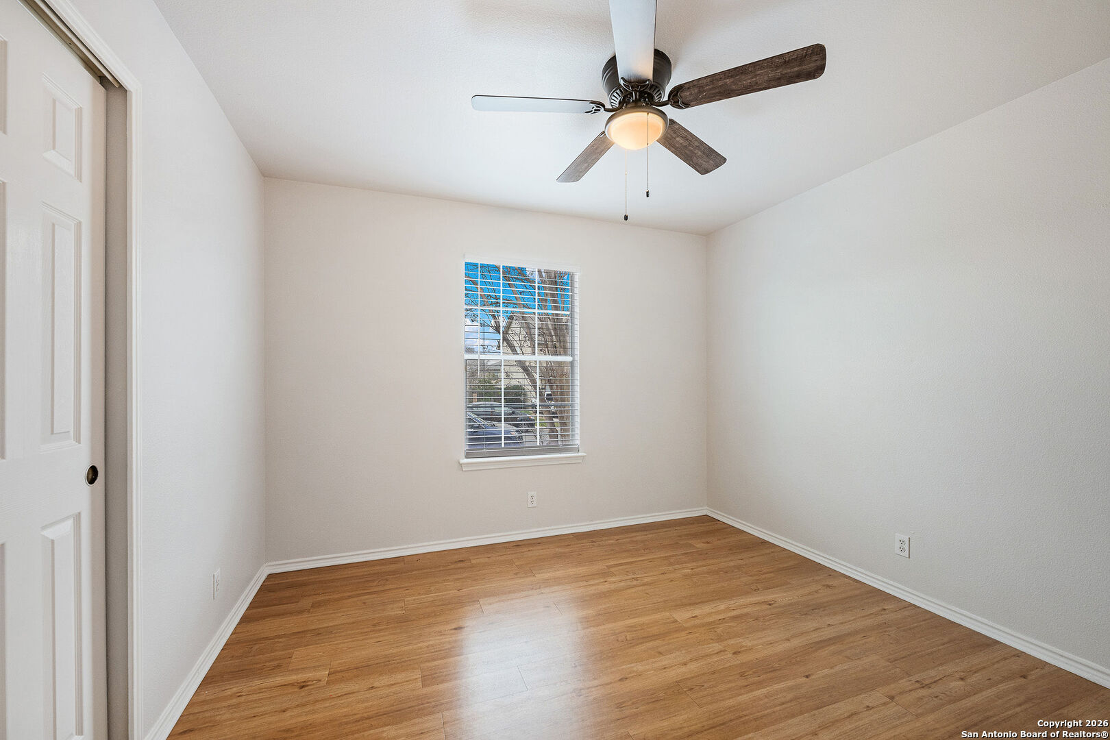 2735 Moon Rock Converse, TX 78109 - Photo 15 of 21 an empty room with a window and a fan