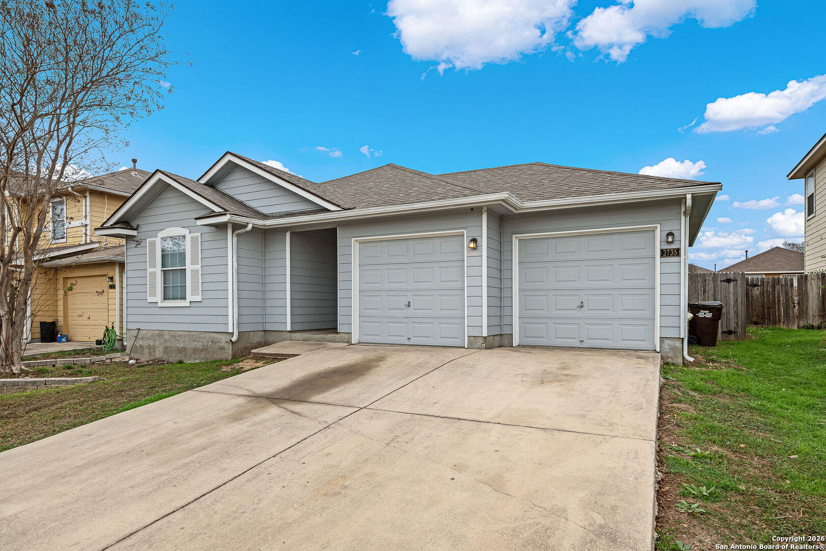 2735 Moon Rock Converse, TX 78109 - Photo 3 of 21 a front view of a house with a yard and garage