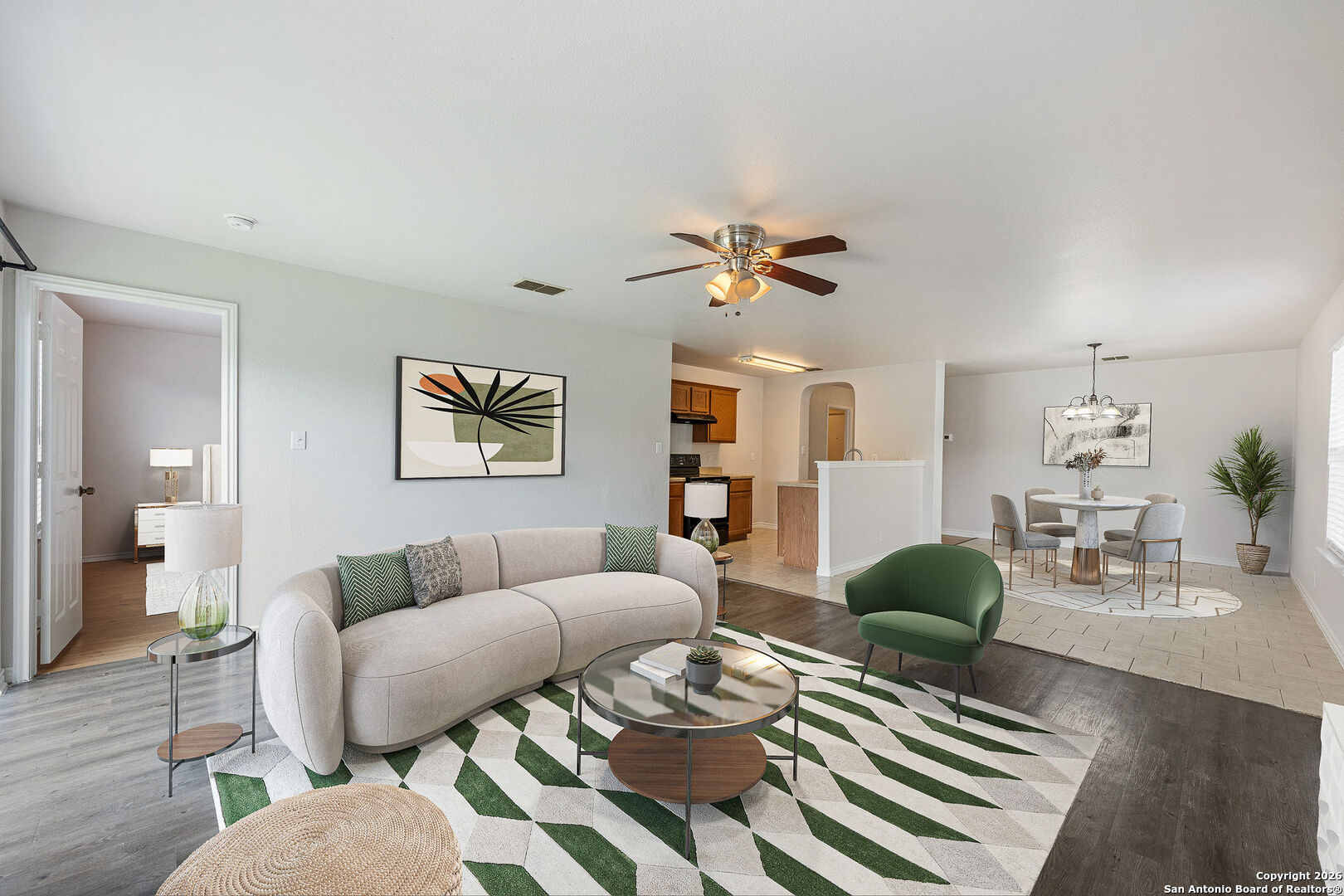 2735 Moon Rock Converse, TX 78109 - Photo 5 of 21 a living room with furniture a rug and a chandelier