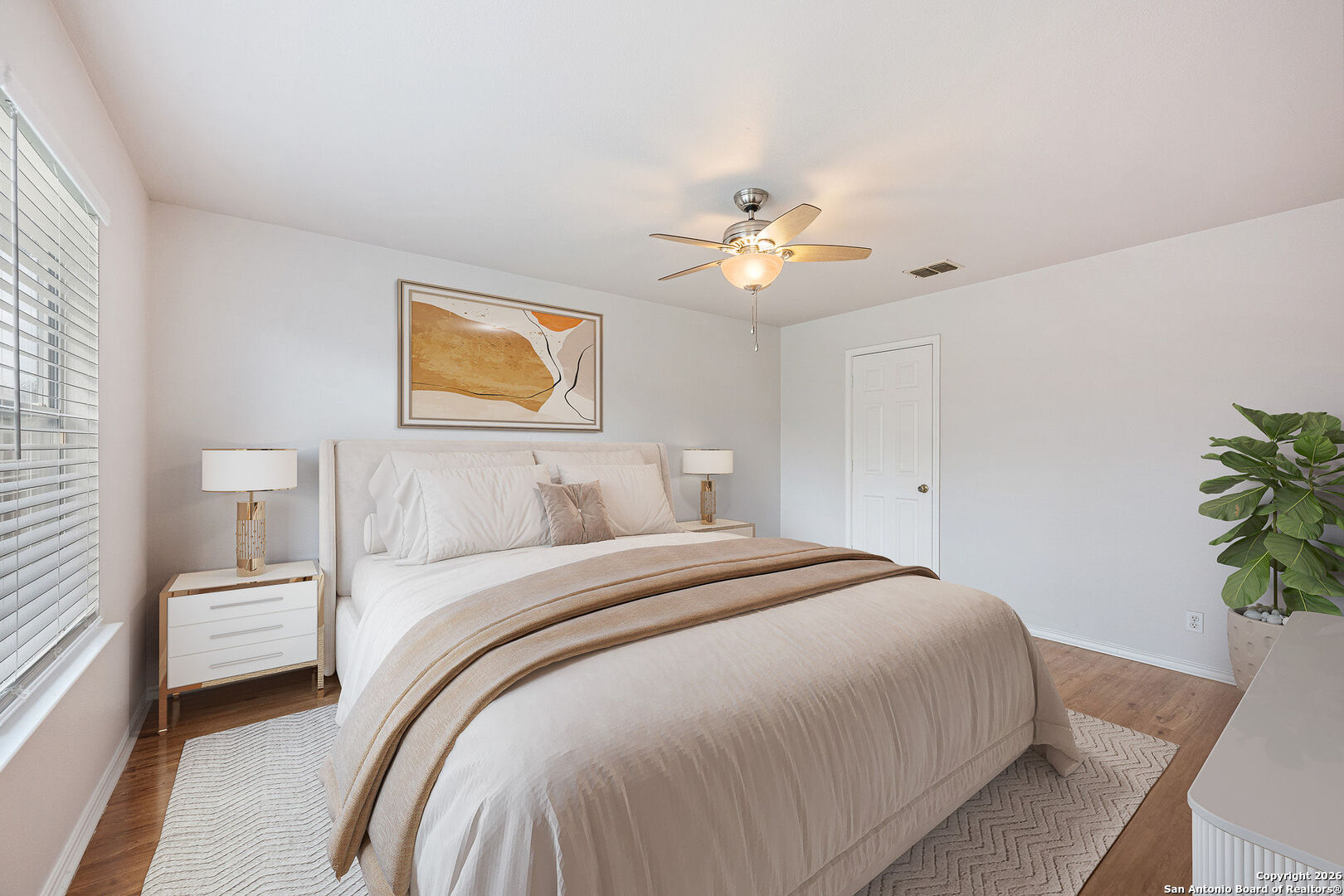 2735 Moon Rock Converse, TX 78109 - Photo 10 of 21 a spacious bedroom with a bed and a chandelier