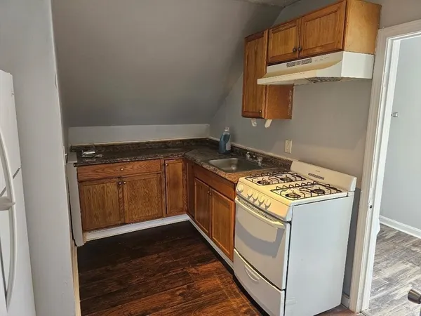 a kitchen with a stove and a microwave