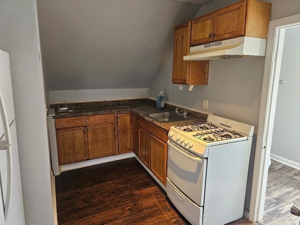 a kitchen with a stove and a microwave