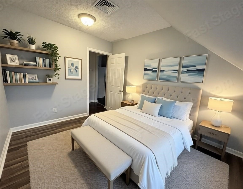 280 5th Street, Unit 3S Fall River, MA 02721 - Photo 5 of 12 a bedroom with a bed and cabinets