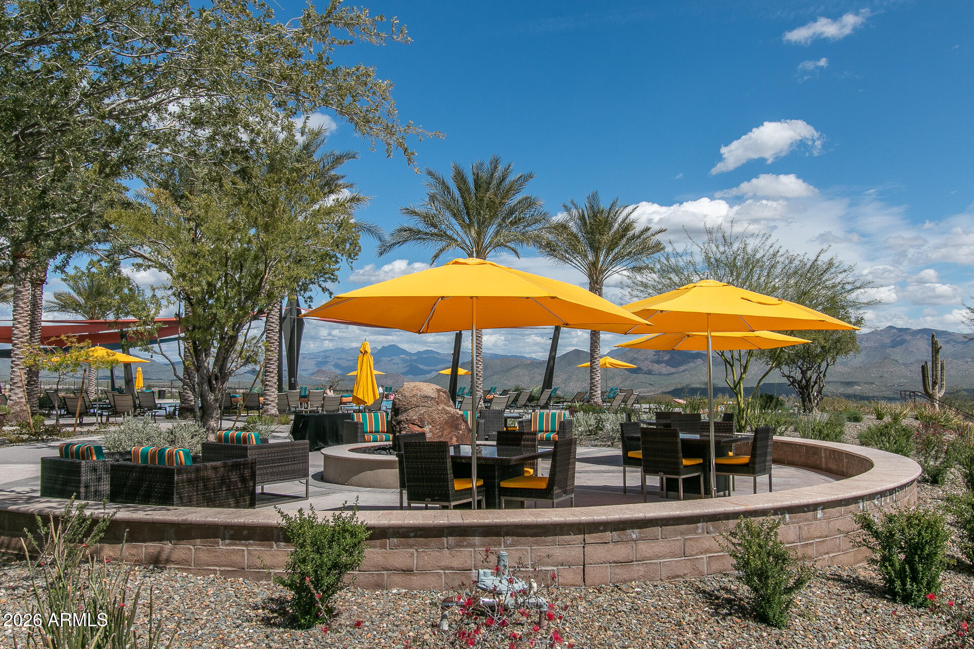 28702 North Camel Rock Court Rio Verde, AZ 85263 - Photo 17 of 38 a view of a patio with a table and chairs under an umbrella