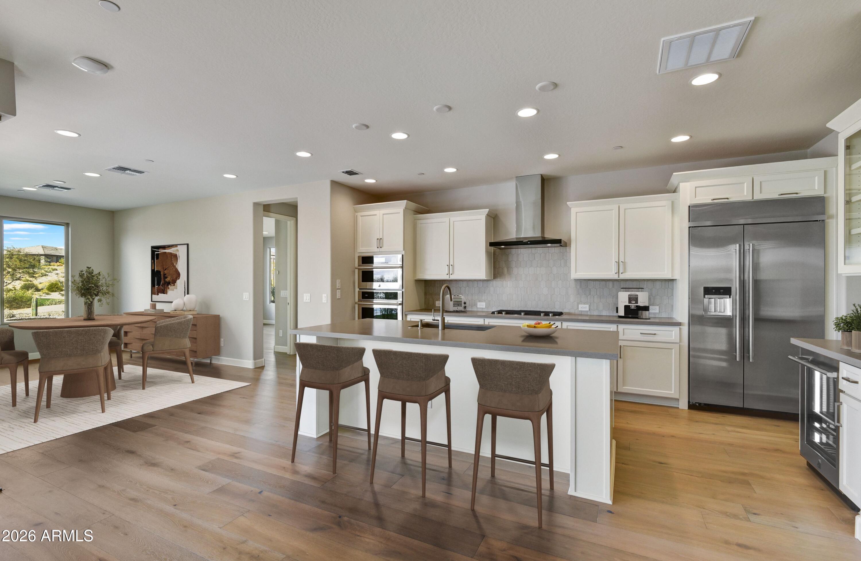 28702 North Camel Rock Court Rio Verde, AZ 85263 - Photo 5 of 38 a kitchen with a table and chairs in it