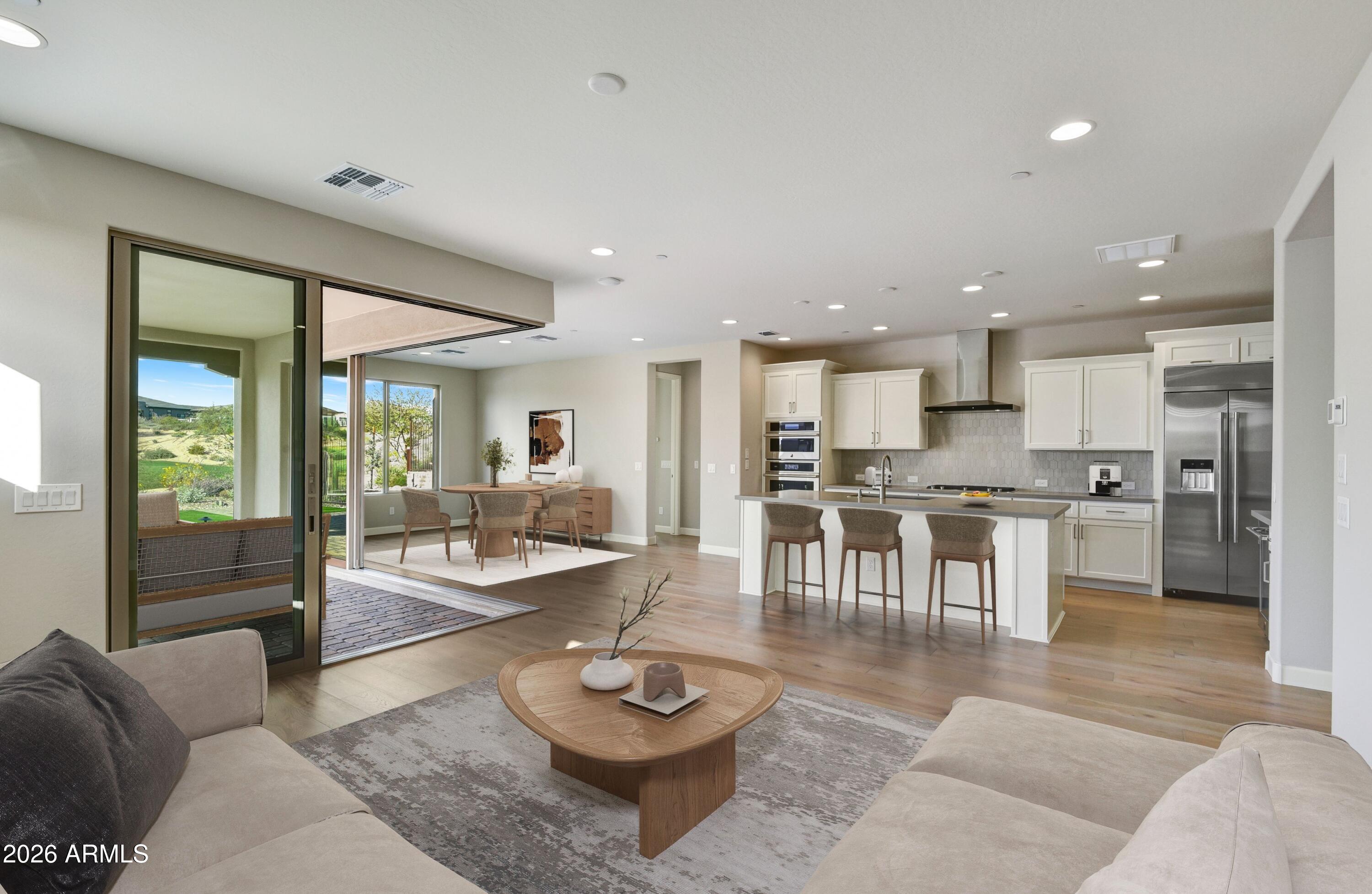28702 North Camel Rock Court Rio Verde, AZ 85263 - Photo 7 of 38 a living room with furniture kitchen and a table