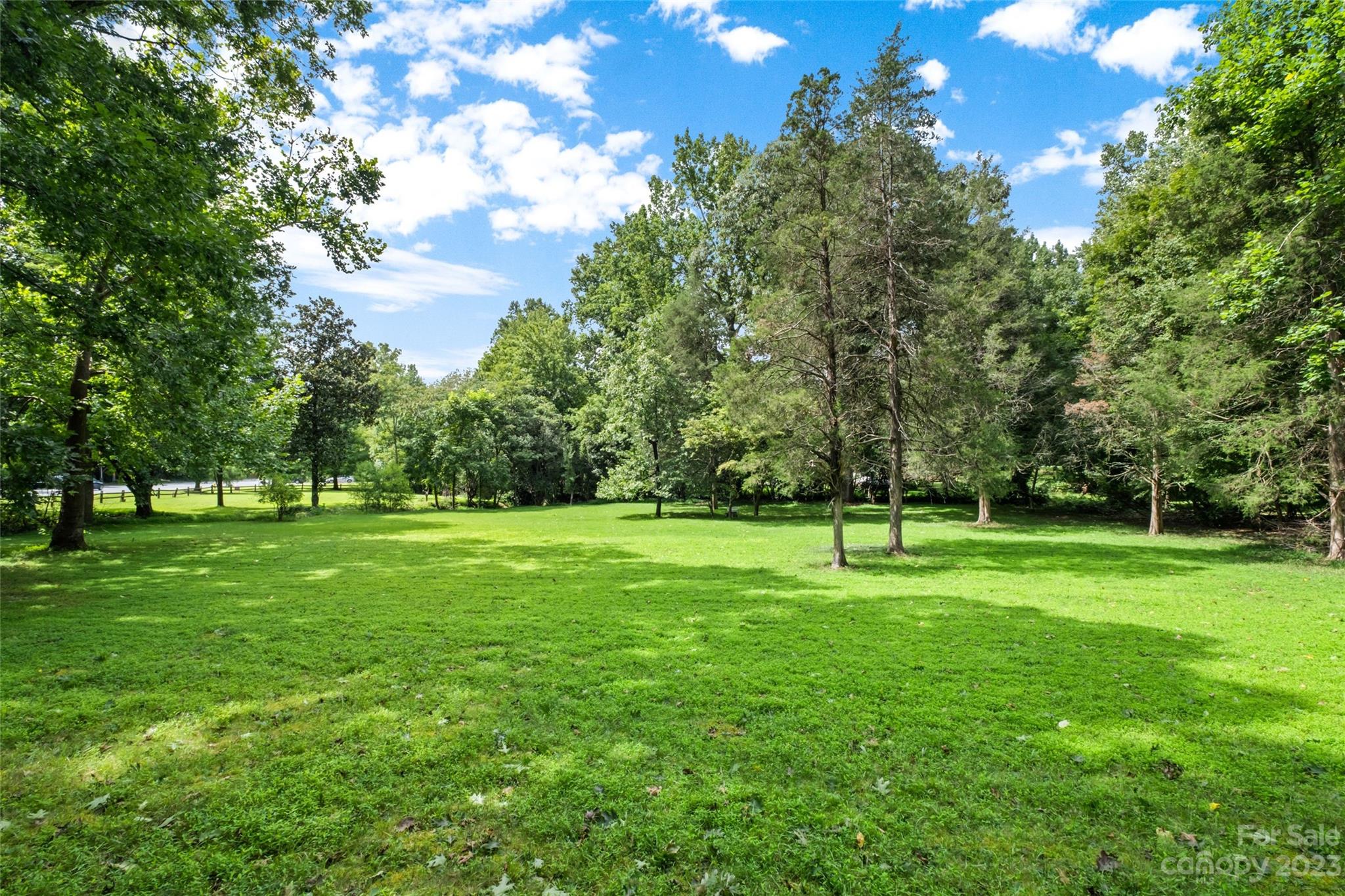 8105 Sardis Road Charlotte, NC 28270 - Photo 1 of 7 a view of green field with trees in the background