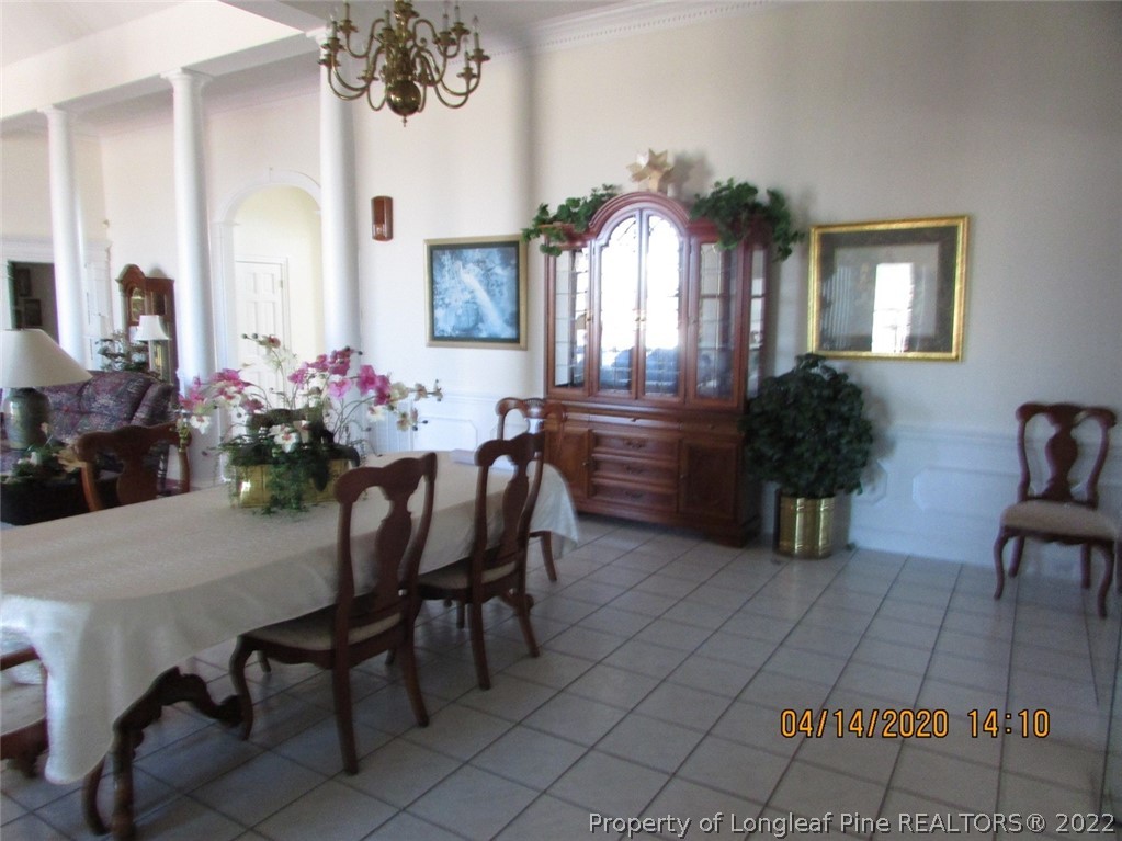 618 Leroy Autry Road Autryville, NC 28318 - Photo 14 of 35 a view of a dining room with furniture and chandelier