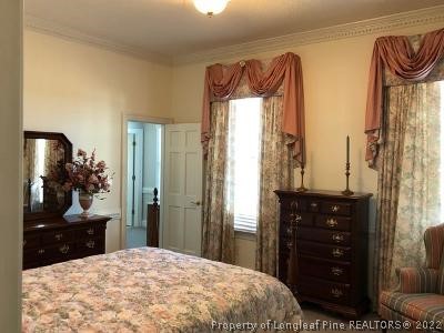 618 Leroy Autry Road Autryville, NC 28318 - Photo 19 of 35 a bedroom with a bed and a dresser
