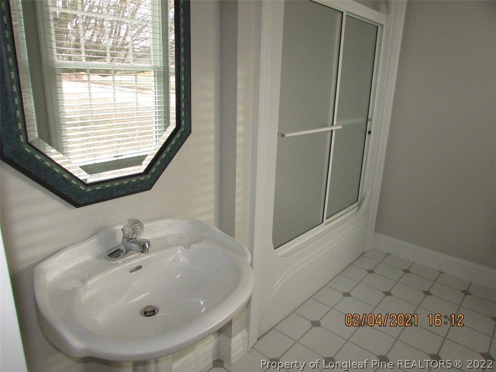 618 Leroy Autry Road Autryville, NC 28318 - Photo 24 of 35 a bathroom with a sink and a window