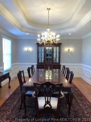 618 Leroy Autry Road Autryville, NC 28318 - Photo 6 of 35 a view of a dining room with furniture and chandelier