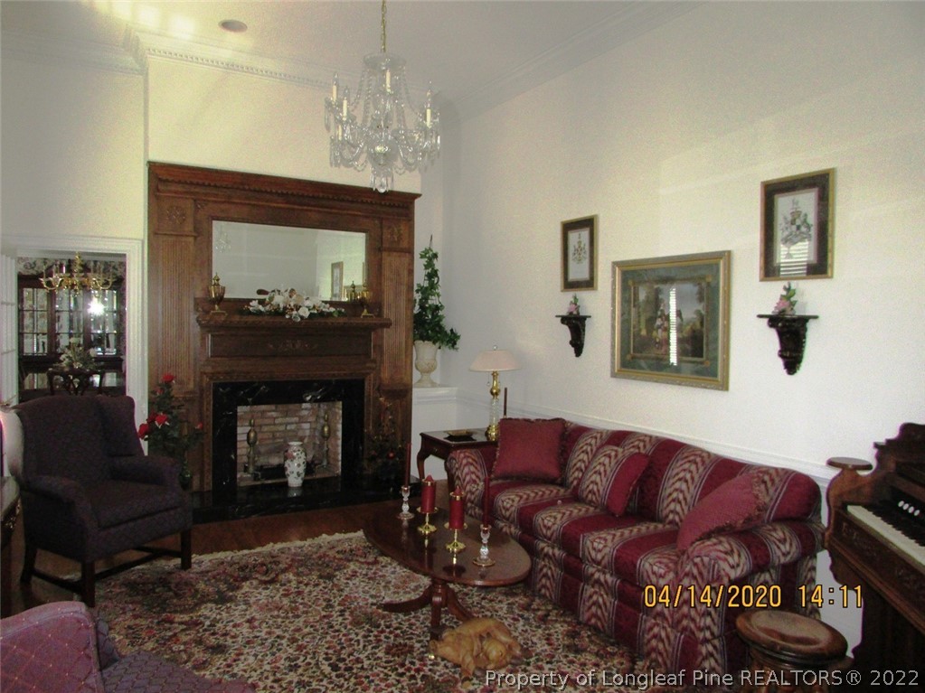 618 Leroy Autry Road Autryville, NC 28318 - Photo 7 of 35 a living room with furniture and a fireplace