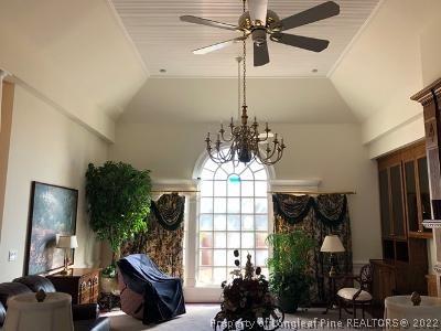618 Leroy Autry Road Autryville, NC 28318 - Photo 9 of 35 a living room with furniture and a chandelier