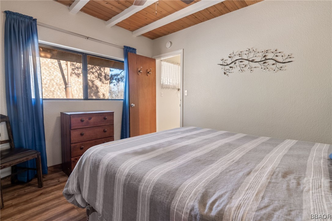 456 Riverside Avenue Sugarloaf, CA 92386 - Photo 11 of 19 a bedroom with a bed and a window