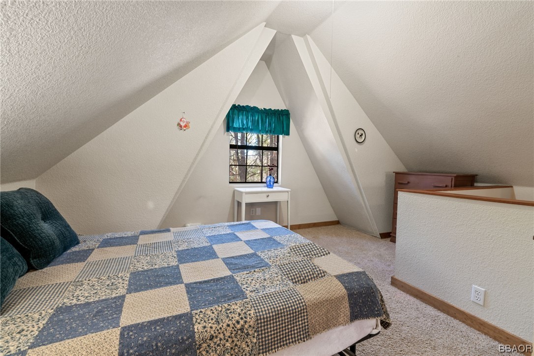 456 Riverside Avenue Sugarloaf, CA 92386 - Photo 15 of 19 a bedroom with a bed and a window
