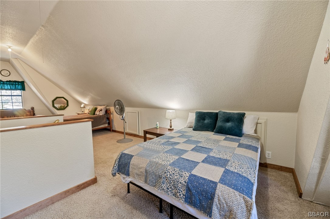456 Riverside Avenue Sugarloaf, CA 92386 - Photo 16 of 19 a bed room with a bed and a tv