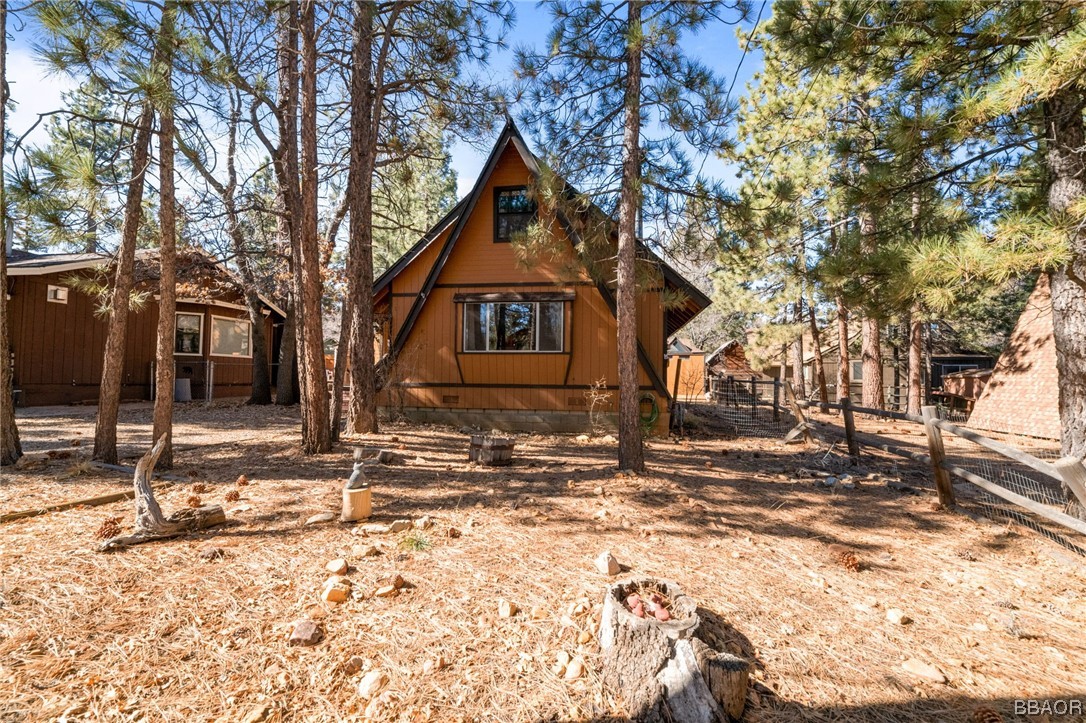 456 Riverside Avenue Sugarloaf, CA 92386 - Photo 2 of 19 a front view of a house with a yard covered in snow