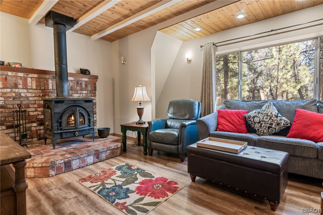 456 Riverside Avenue Sugarloaf, CA 92386 - Photo 6 of 19 a living room with furniture or couch and a fireplace