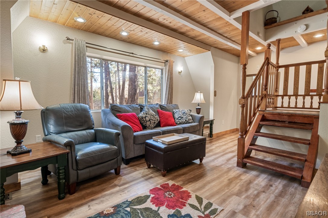 456 Riverside Avenue Sugarloaf, CA 92386 - Photo 8 of 19 a living room with furniture and a wooden floor