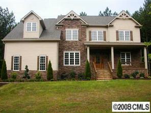 124 Streamwood Road, Unit 15 Troutman, NC 28166 - Photo 1 of 8 a front view of a house with a yard