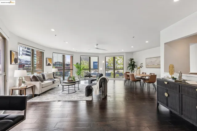a kitchen with stainless steel appliances kitchen island granite countertop wooden cabinets and granite counter tops
