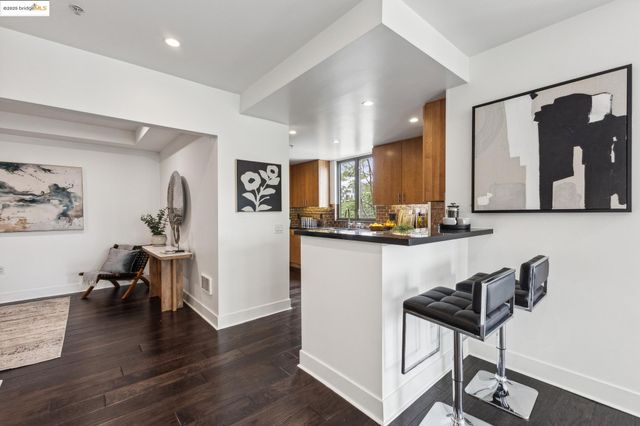 a living room with furniture and large windows