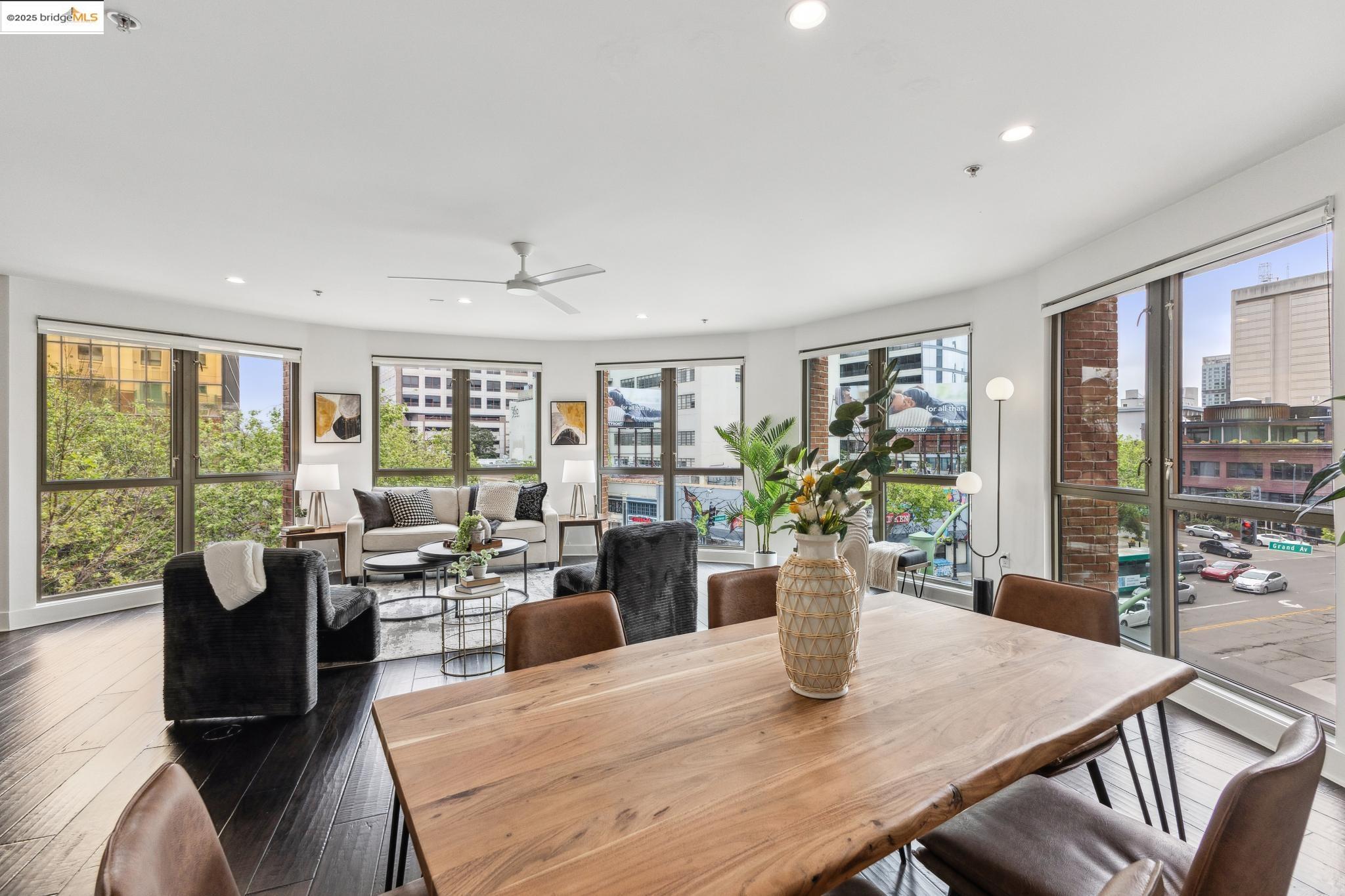 438 West Grand Avenue, Unit 420 Oakland, CA 94612 - Photo 21 of 58 a view of a dining room with furniture window and wooden floor