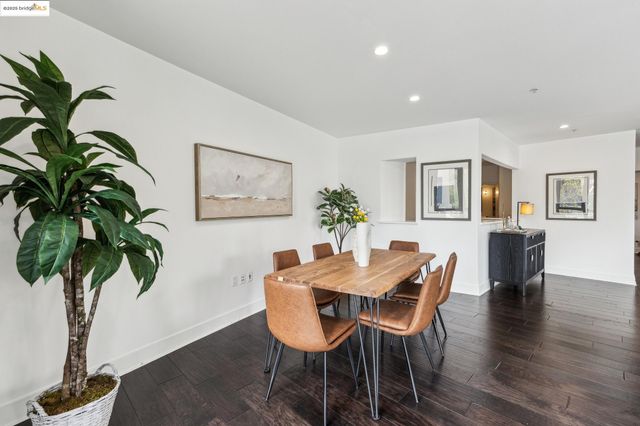 a living room with furniture and floor to ceiling windows