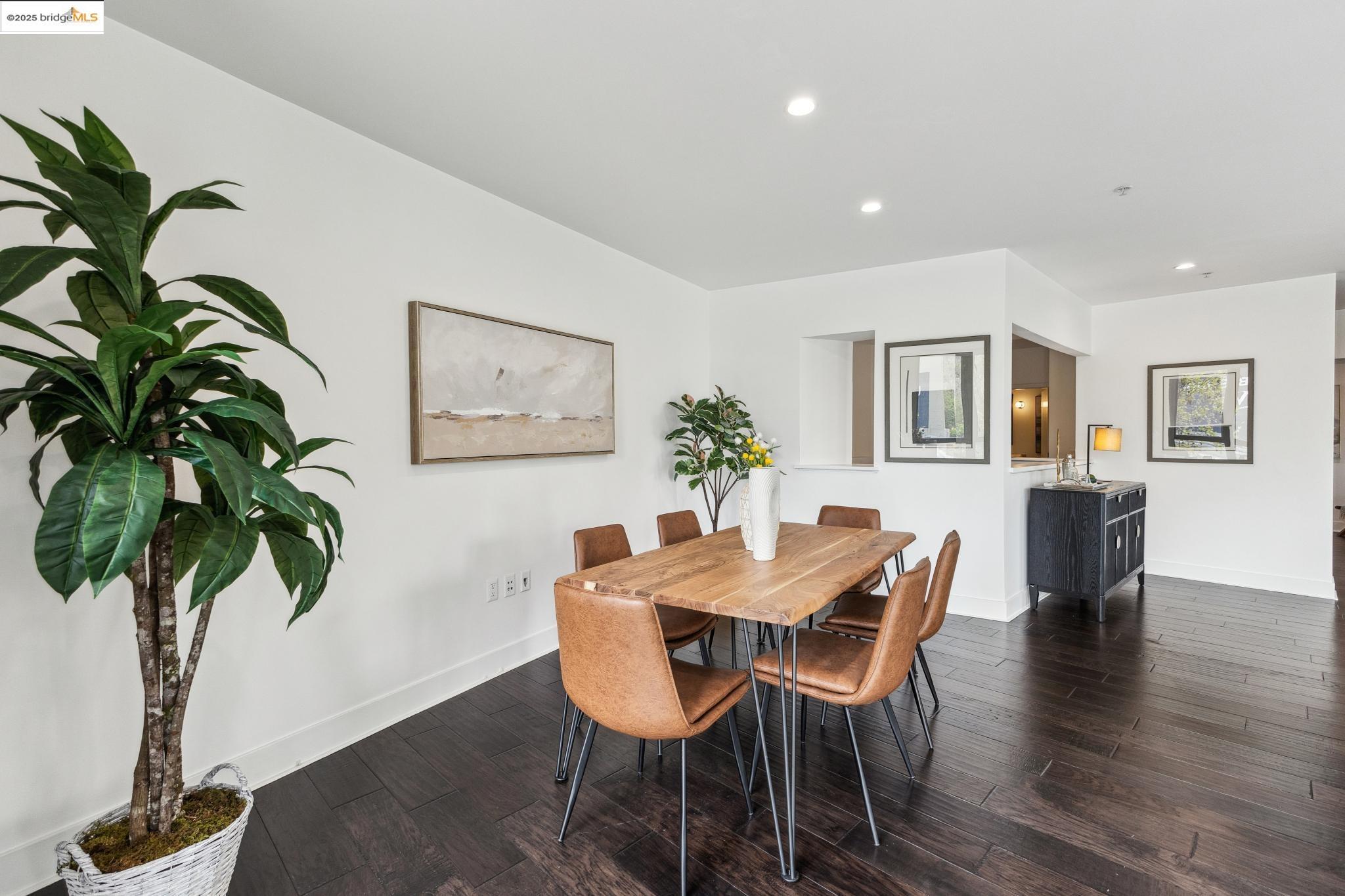 438 West Grand Avenue, Unit 420 Oakland, CA 94612 - Photo 22 of 58 a view of a dining room with furniture and wooden floor