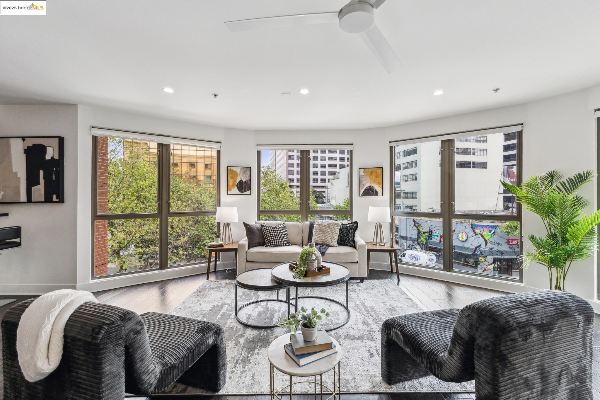 438 West Grand Avenue, Unit 420 Oakland, CA 94612 - Photo 24 of 58 a living room with furniture and a large window