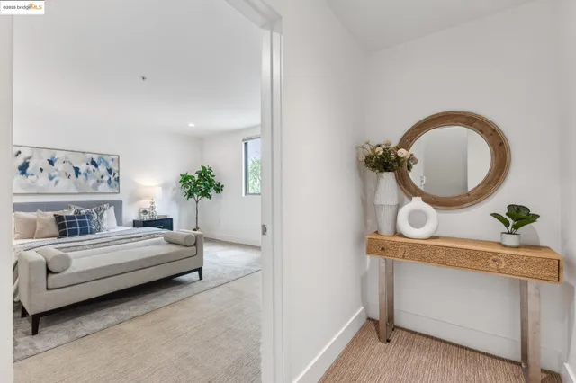 a spacious bedroom with a bed and a couch