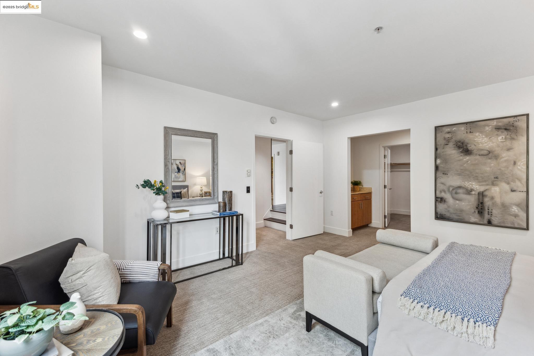 438 West Grand Avenue, Unit 420 Oakland, CA 94612 - Photo 30 of 58 a living room with furniture and wooden floor