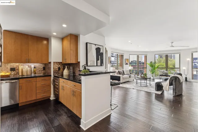 a kitchen with sink a window and cabinets