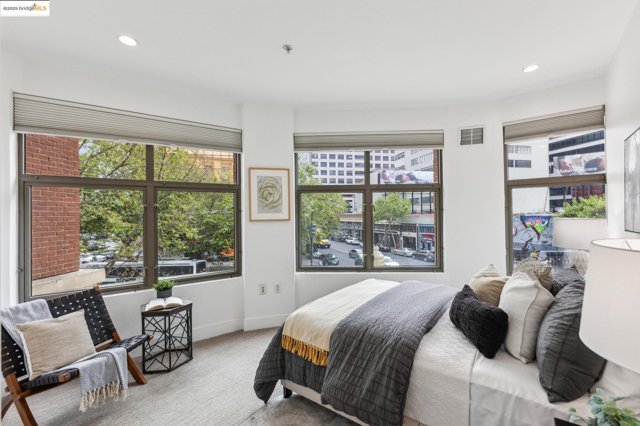 438 West Grand Avenue, Unit 420 Oakland, CA 94612 - Photo 36 of 58 a bedroom with a bed and a large window