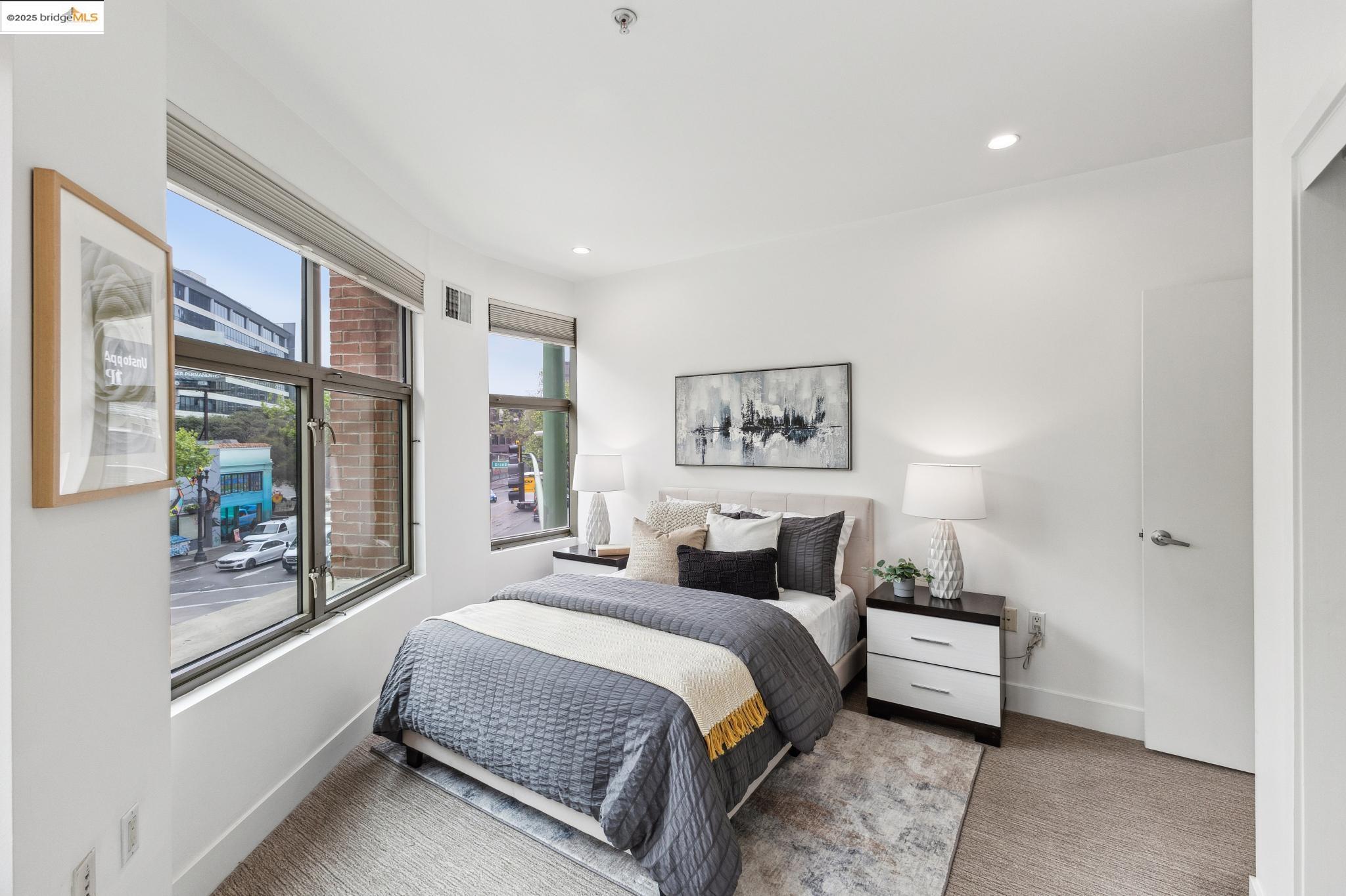 438 West Grand Avenue, Unit 420 Oakland, CA 94612 - Photo 37 of 58 a bedroom with a large bed and a window