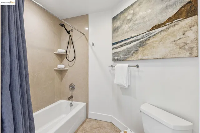 a bedroom with bed and a window