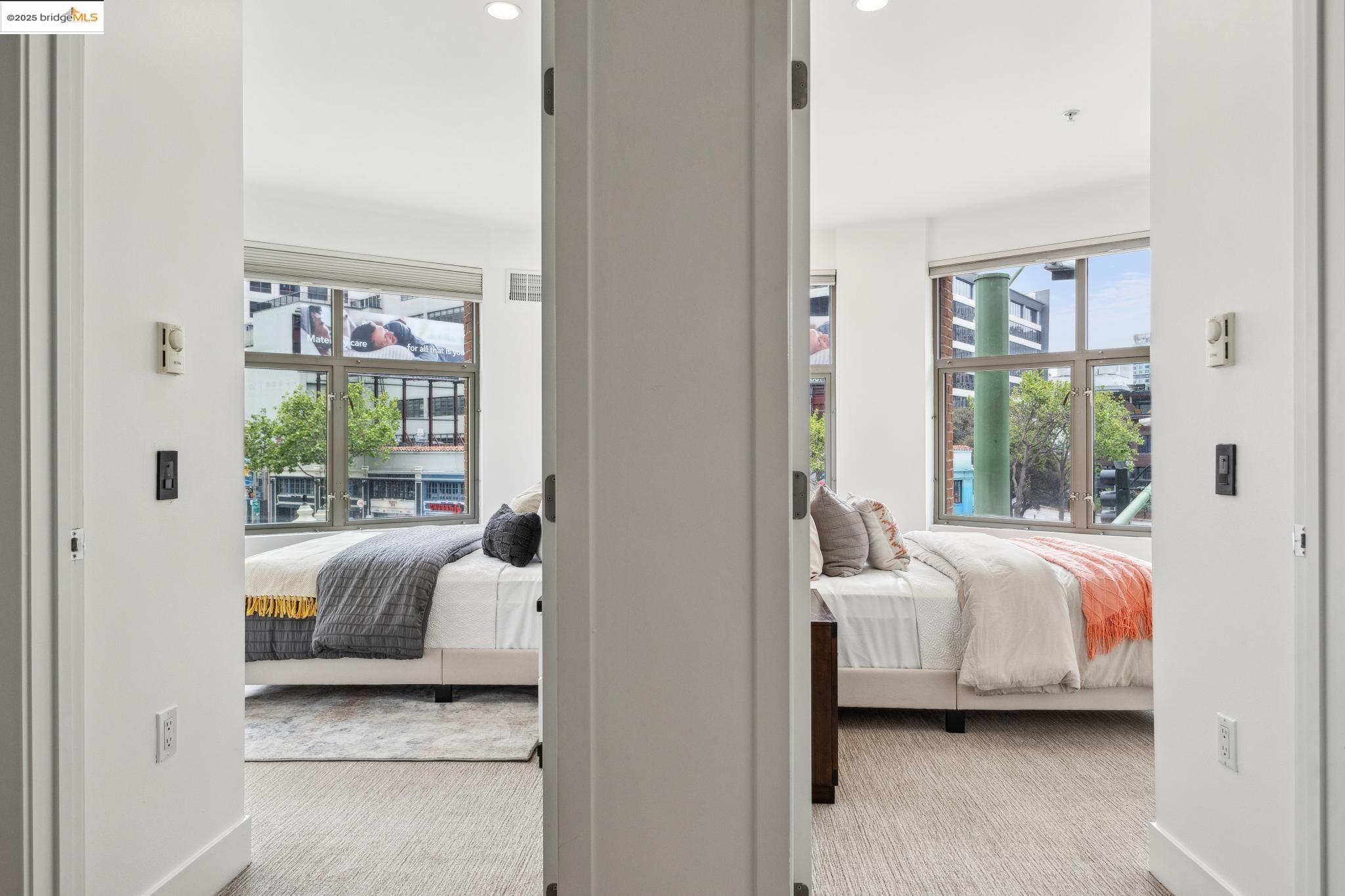 438 West Grand Avenue, Unit 420 Oakland, CA 94612 - Photo 42 of 58 a bedroom with bed and a window