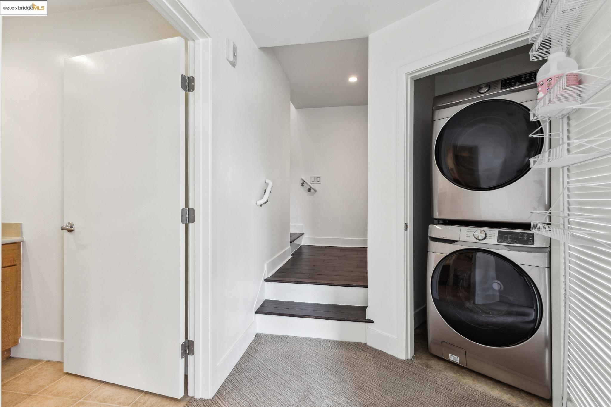 438 West Grand Avenue, Unit 420 Oakland, CA 94612 - Photo 44 of 58 a view of a hallway with washer and dryer