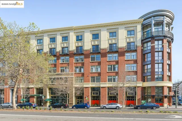a view of a building with garden and sitting area