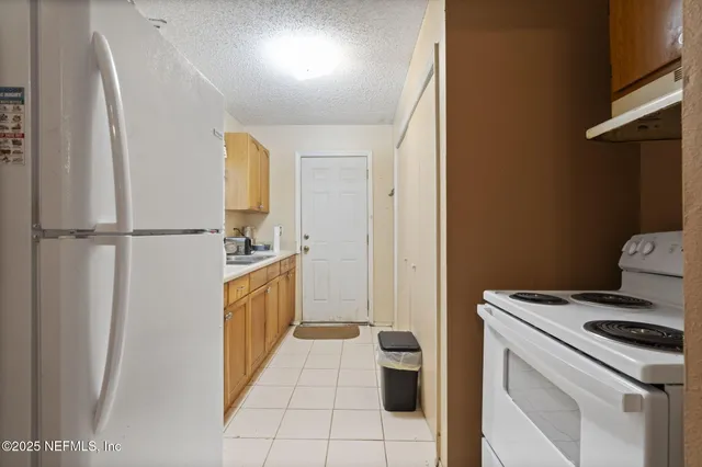 a living room with furniture and a ceiling fan