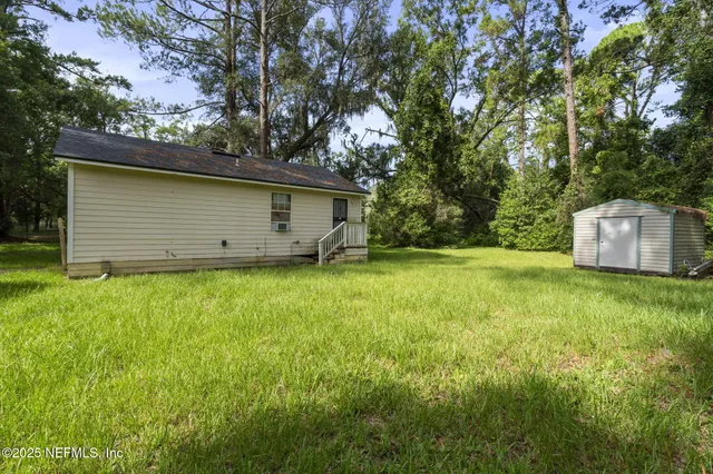 a backyard of a house with lots of green space