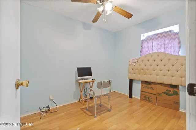 a workspace room with a wooden floor and breakfast area