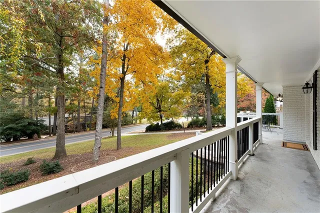 a view of a trees from a balcony