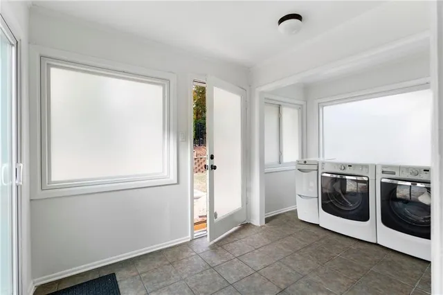 a view of a kitchen with washer and dryer